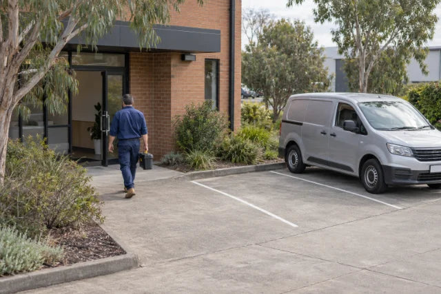 AI human and vehicle detection security camera scene - illustrative business entrance